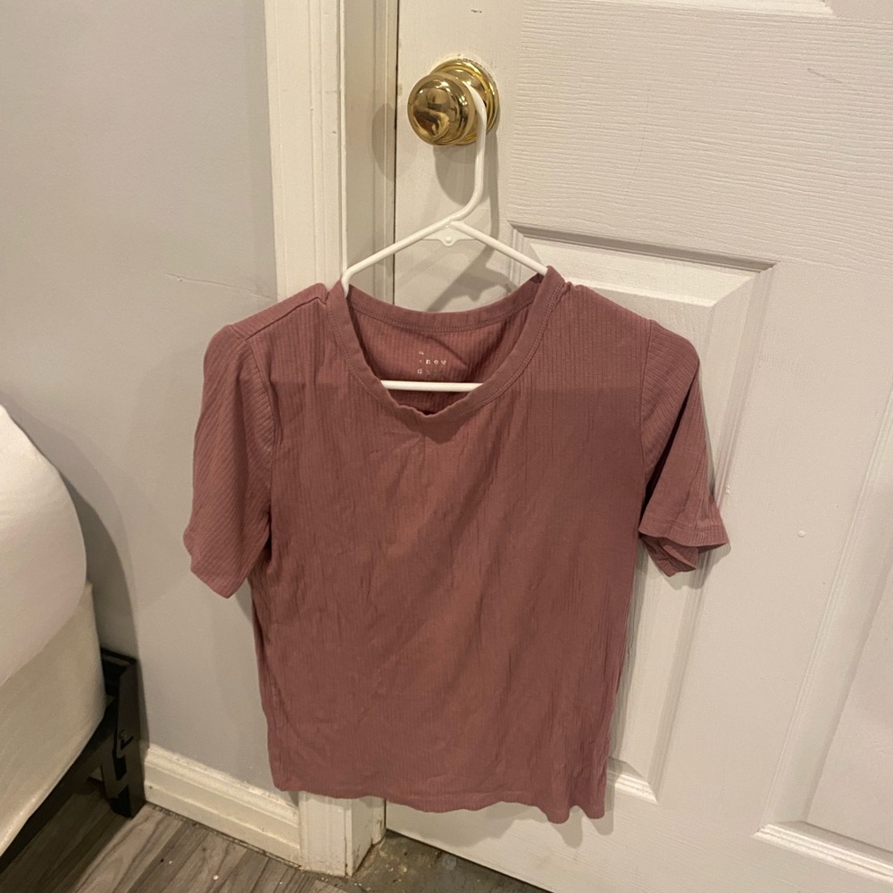 Woman’s purple T-shirt size large